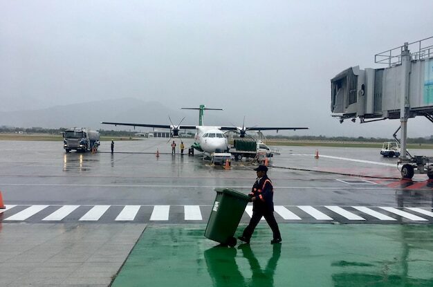 Airport Transportation 13 man pushing garbage can airport runway rainy season 1048944 30925453 e1759923464937